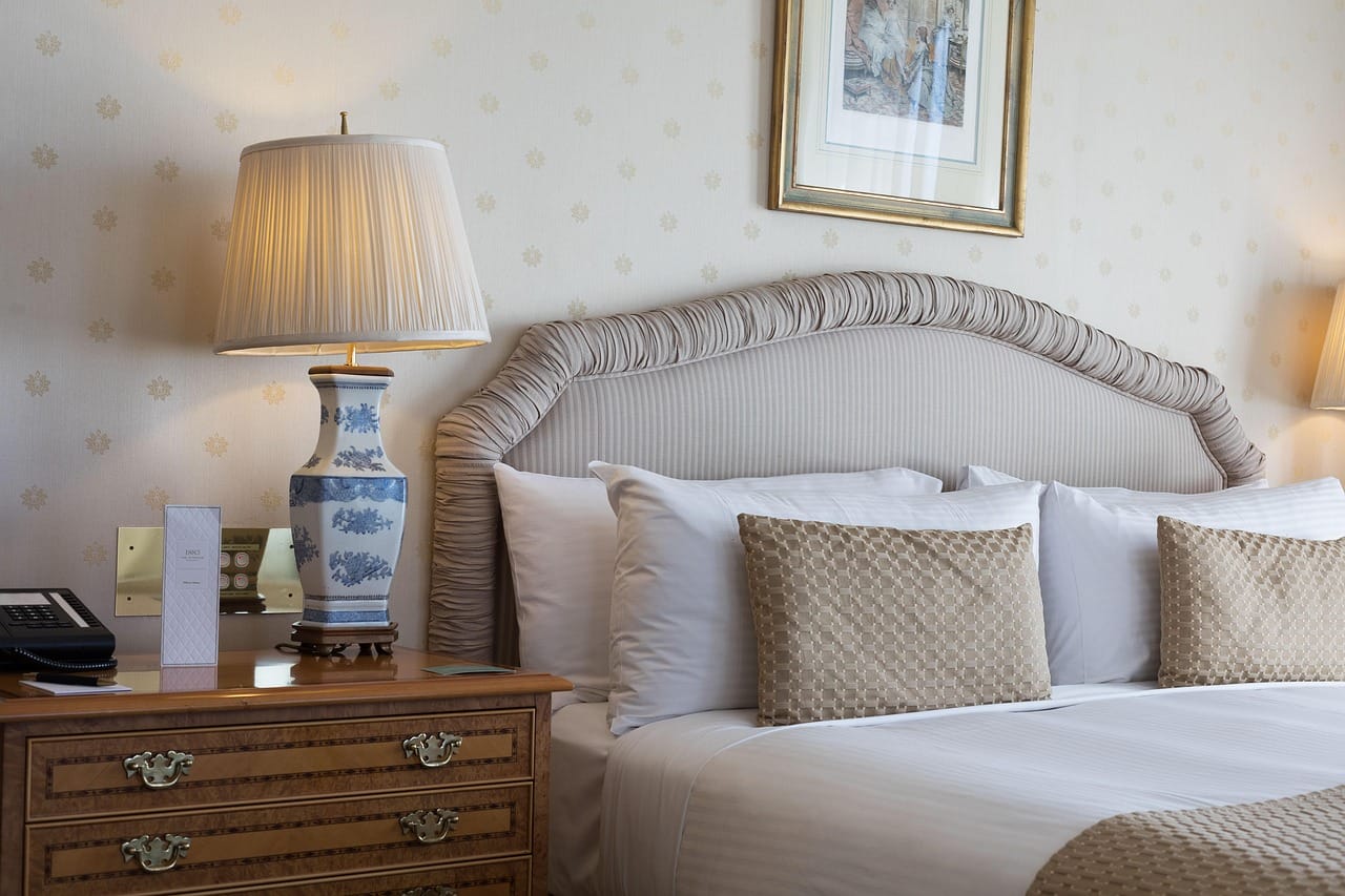 A small bedside lamp with a fabric shade and a warm, dim bulb.