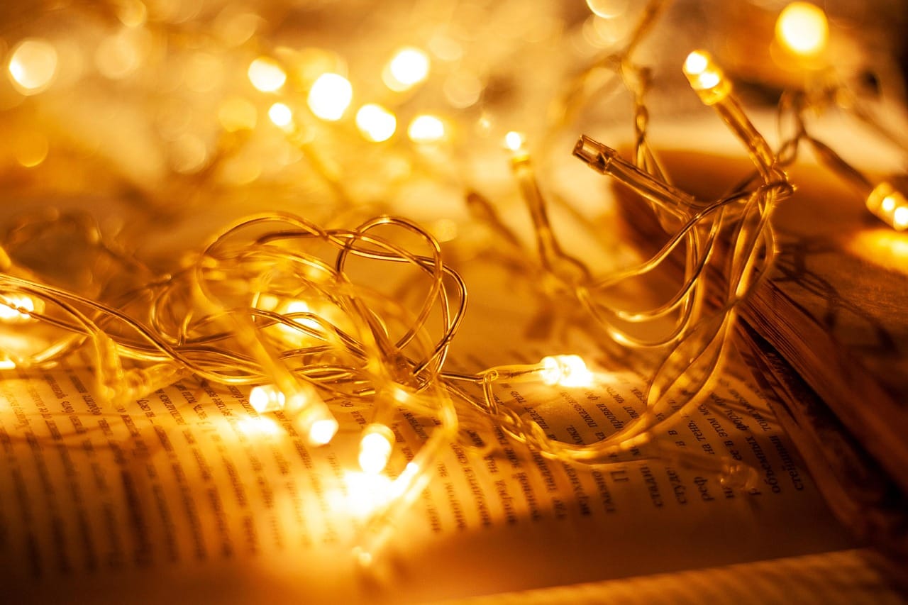 One string of warm lights along the railing made the balcony a room.