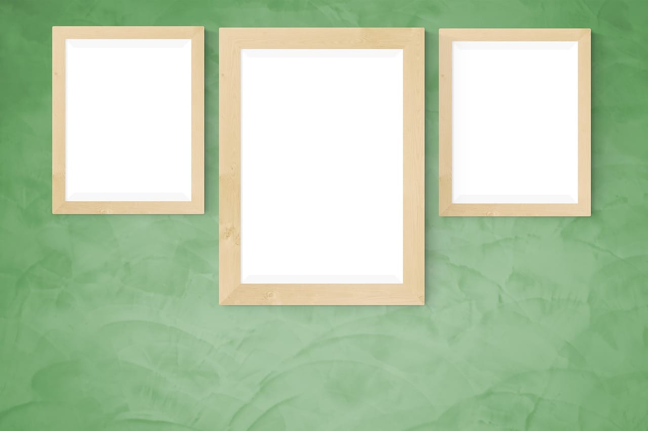 A deeper green with oak frames: calm rather than dark.