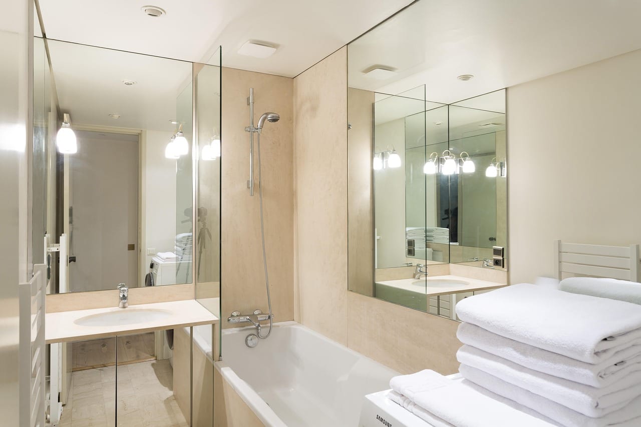 Where the bath meets the wall: the seal that goes black first. Fill the bath before you reseal it.
