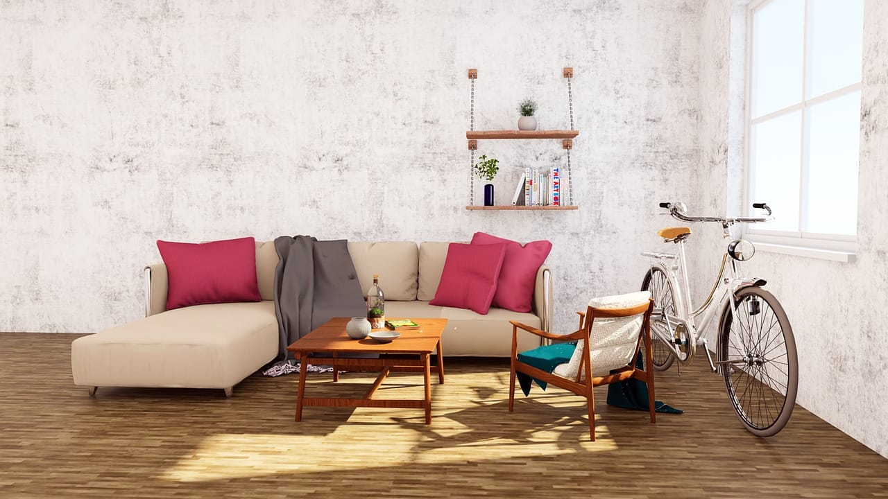A room built from one bowl: parchment walls, a sage sofa and terracotta cushions.