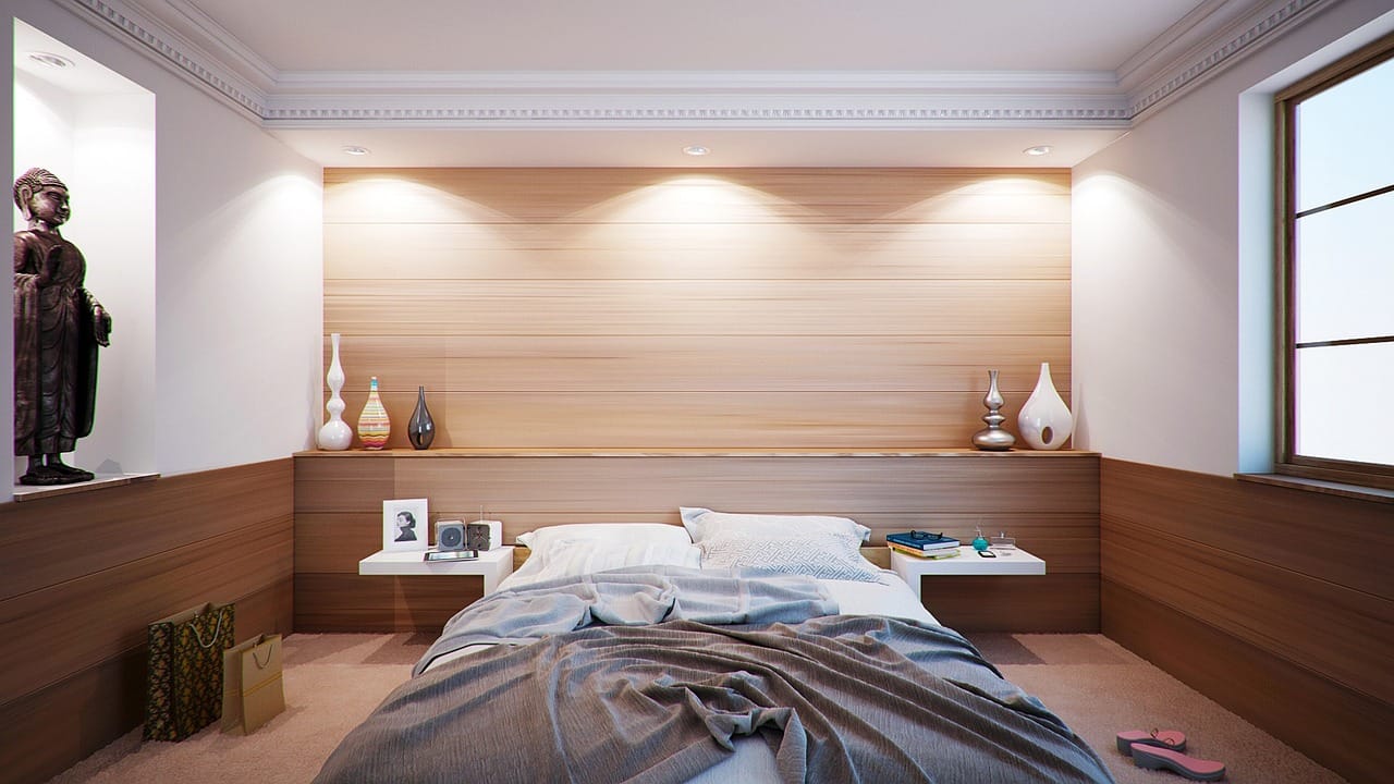 The bedroom has one colour, one texture and one reading lamp.