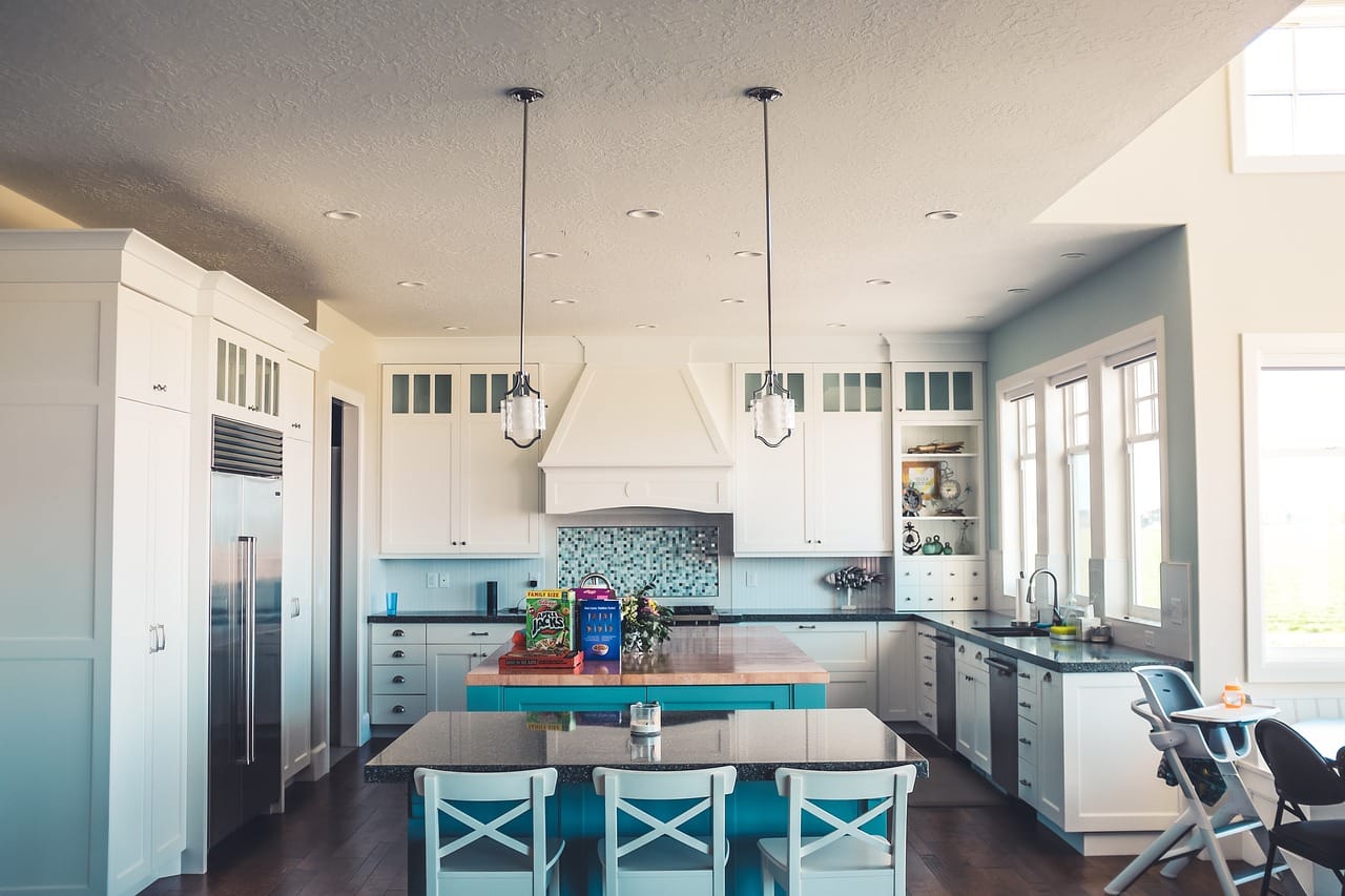 The kitchen moved into the middle room, with a table by the garden doors.